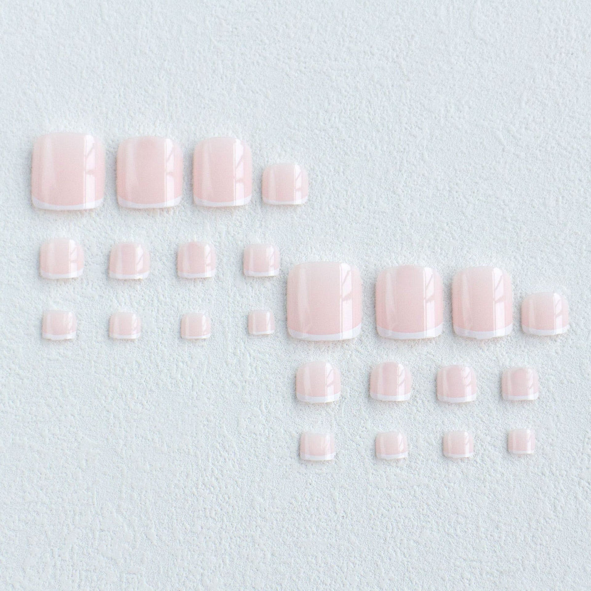 Faux Ongles Pieds Rose Clair avec Ligne Blanche – 12 Capsules + Kit de Pose Inclus